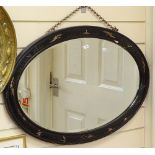 An Oriental lacquered and giltwood chinoiserie oval wall mirror, length 77cm