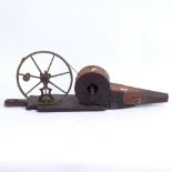 A 19th century mahogany and brass peat bellows, wheel-mounted crank on stained pine base, overall