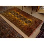 An orange ground Beluchi design rug, 195cm x 105cm