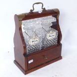 A Vintage oak-cased brass-bound tantalus, with 2 original glass decanters and porcelain labels,