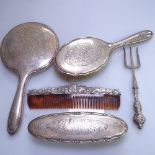 A 3-piece silver-backed dressing table brush and mirror set, a silver-handled toasting fork, and a