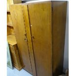 A Vintage maple walnut gentleman's 2-door fitted wardrobe, bears label to the inside of the door,