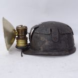 A Vintage plastic Premier miner's helmet lamp