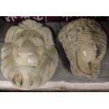 A concrete lion wall mask, and another (2)