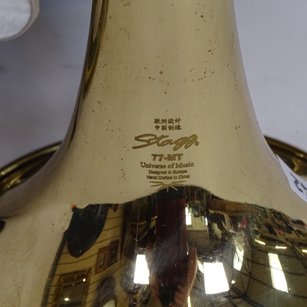 A Stagg 77-MT gold lacquered 3-valve pocket trumpet, serial no. 3419, length 24cm, in original Stagg - Image 2 of 2