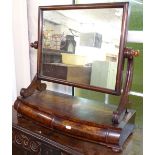 A 19th century mahogany bow-front swing toilet mirror, base fitted with 2 barrel short frieze
