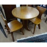 A craftsman made circular teak table, and 2 matching chairs, with maker's stamp under