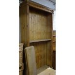 A large polished pine floor standing open bookcase, with 5 adjustable shelves, W124cm, H231cm