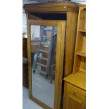 A Antique ash wardrobe with castellated cornice, single mirrored door, on plinth base, W103cm,