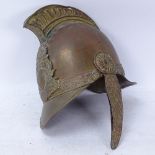 A 19th century French brass fireman's helmet, with badge for SBS Pompiers de Chenerailles