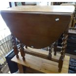 An oak oval barley twist gateleg table, W68cm