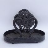 A Victorian black painted cast-iron boot scraper with tray, tray length 41cm