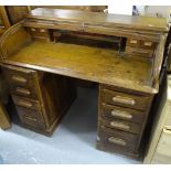 A 1920s oak roll-top twin-pedestal writing desk, W122cm