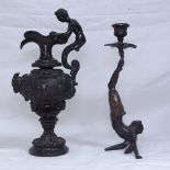 A reproduction bronze ewer, a reproduction bronze candlestick
