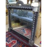 A 19th century stained and gilded over mantel mirror, with applied carved and gilded decoration,