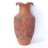 A Japanese redware vase, with shaped rim and embossed dragon decoration, height 43cm