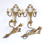 A set of 4 cast-brass wall-mounted twin branch light fittings