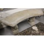 A concrete curved garden seat on squirrel supports, L105cm