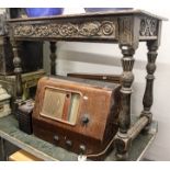 Antique oak side table, with relief carved frieze drawer, on turned legs, W104cm