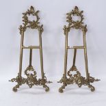 A pair of brass strut pictures stands, foliate decoration with scrolled acanthus feet, overall