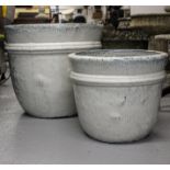 A pair of circular graduated white glazed garden planters, tallest 46cm