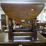 An oak drop leaf swivel-top occasional table, W54cm