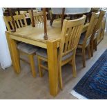 A good quality modern oak rectangular dining table, together with a set of 6 matching oak dining