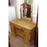 An Art Deco limed oak knee-hole dressing table, fitted with drawers and cupboards, W116cm