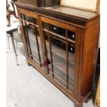 An Edwardian mahogany bookcase with 2 lattice-glazed doors, on shaped bracket feet, W135cm, H119cm