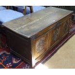 An 18th century joined oak coffer, chip carved panelled front, on stile legs, W122cm