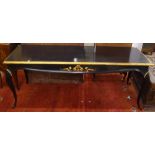 An Antique ebonised and gilded rectangular console table, with applied carved decoration, on
