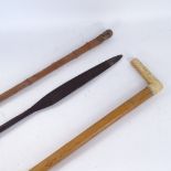 A Tribal hunting spear tip, an Oriental bamboo cane, and an ivory-handled walking stick, longest