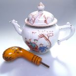 A Chinese porcelain teapot with painted design of figures in a garden, height 14.5cm, and a