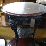 A circular pub table on embossed cast-iron base, W60cm