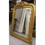 An Antique giltwood and gesso arch-top over mantel mirror, with acanthus leaf pediment, W86cm,
