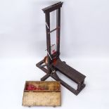 A novelty model executioner's guillotine with pine casket, model height 61cm