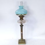 A 19th century brass Corinthian column oil lamp with blue glass shade and cut-glass font, overall