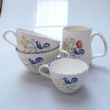 A large quantity of Poole Pottery tea, dinner and coffeeware, with painted floral motifs,
