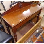 A Victorian mahogany hall table, raised back, end frieze drawer, raised on turned legs, W106cm
