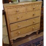 A polished pine chest of 2 short and 3 long drawers on bun feet, W115cm