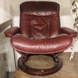 An Ekornes leather reclining armchair