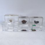 A collection of glass paperweight prisms, and rock specimens