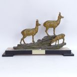 An Art Deco patinated spelter mountain goat sculpture, unsigned, on black marble and green onyx