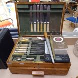 An Edwardian oak canteen box with fitted drawer, and a quantity of miscellaneous cutlery