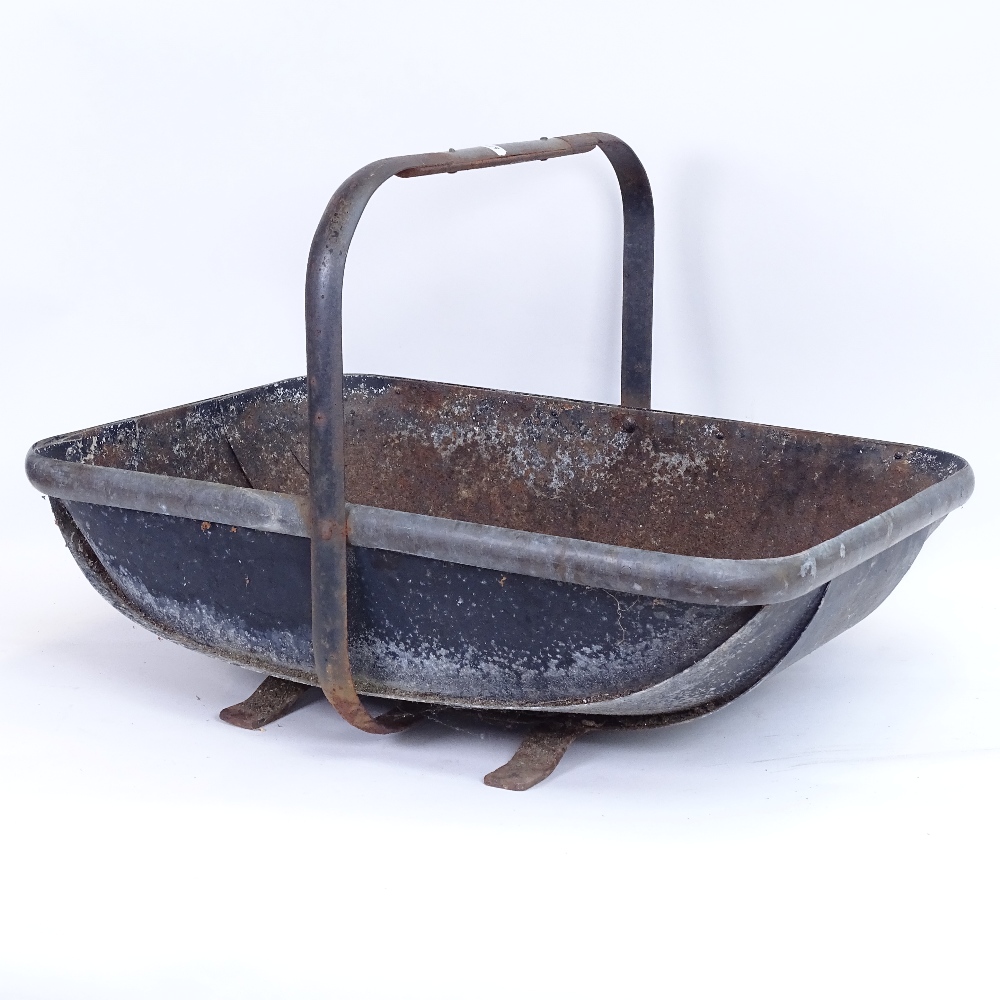 A large cast-iron and brass-bound trug design log basket, length 58cm