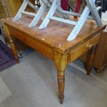 A rectangular pine kitchen table, with end frieze drawer, raised on turned legs, W119cm