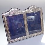 A modern sterling silver embossed double photo frame, width 22cm