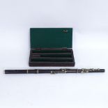 A good quality 4-section rosewood flute, end cap for Rudall & Rose, no other stamps or markings,