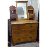 An Arts and Crafts light oak dressing chest, with stylised copper handles, W91cm