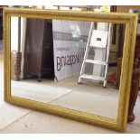 An Antique giltwood and gesso-framed wall mirror, 91cm x 122cm